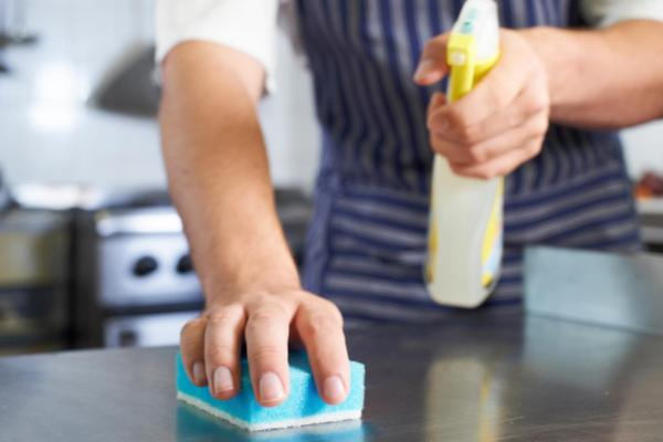 Employee cleaning a surface