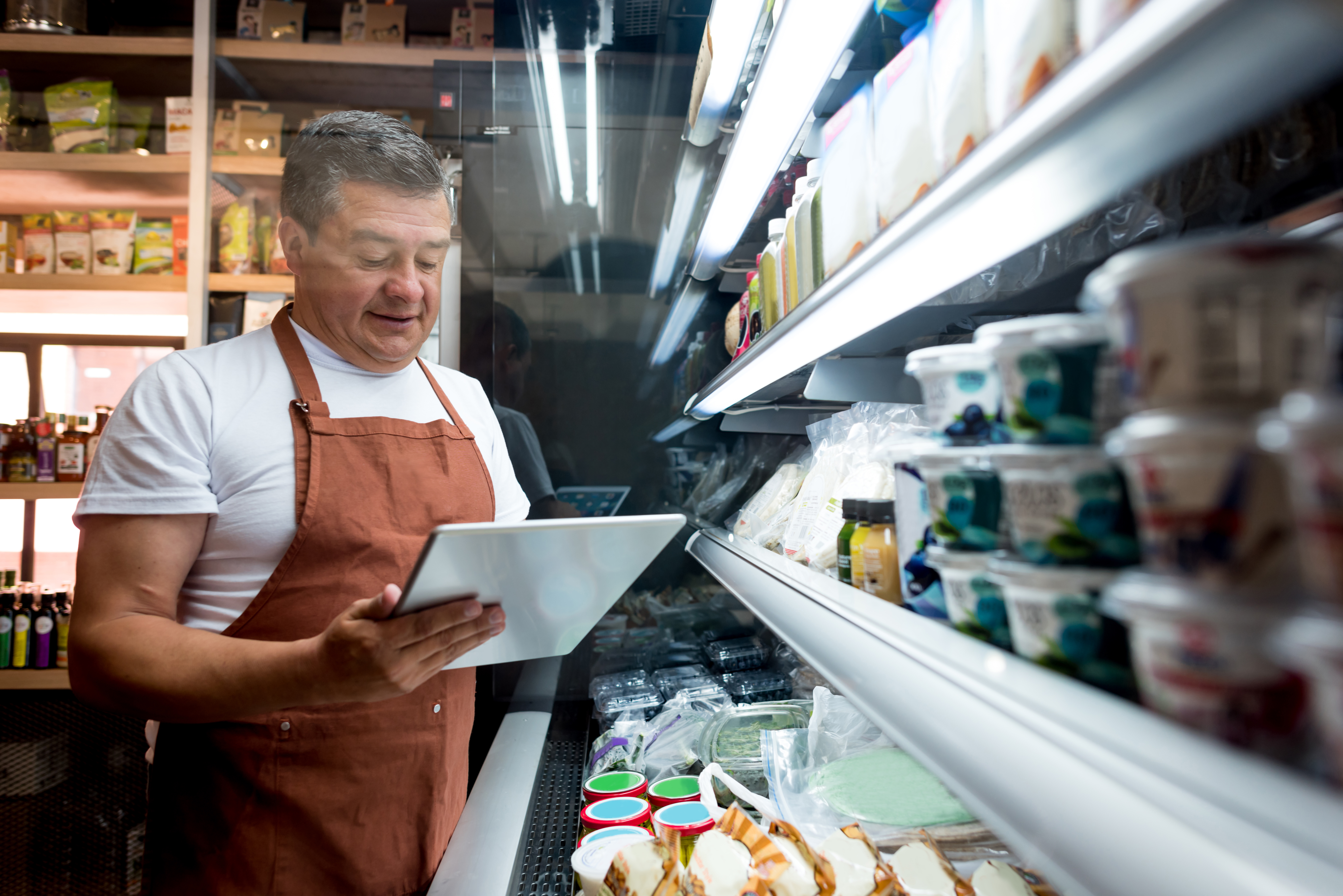 An employee using an iPad to complete work.